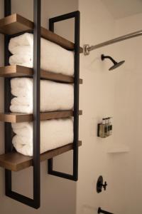 a towel rack in a bathroom with towels at River Canyon Lodge in Moab