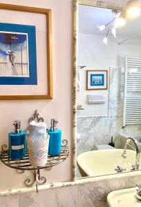 a bathroom with a sink and a mirror at Lagoon Secret Venice in Venice