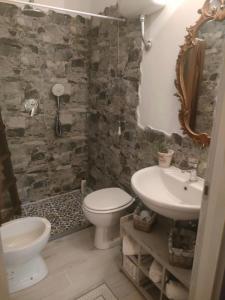 a bathroom with a toilet and a sink at La casa di Noah in Montecatini Terme