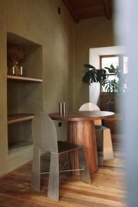 a dining room with a table and a chair at Design Apartment in Downtown Cusco in Cusco