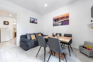 a living room with a table and a couch at Welcome Apartment - Old Town in Dubrovnik