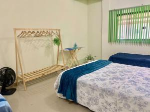 เตียงในห้องที่ Melhor valor de Brasília próximo ao Aeroporto e Plano