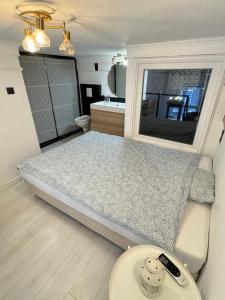a small bedroom with a bed and a table at 4 you in Budapest