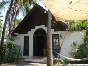 a house with a black and white facade at Hotel Mandacarú Puerto Viejo in Puerto Viejo