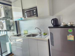 Kuchyň nebo kuchyňský kout v ubytování 中央公寓 1bedroom Centrio 804 Condominium 211