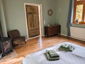 a bedroom with a bed and a wood stove at Ferienhaus Salvia 