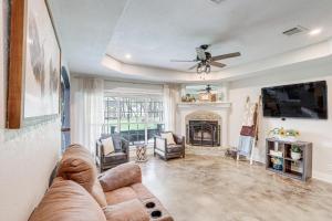 a living room with a couch and a fireplace at 5 Mi to Belton Lake Peaceful Home with Hot Tub in Belton