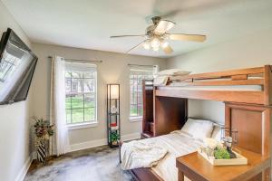 a bedroom with a bunk bed and a ceiling fan at 5 Mi to Belton Lake Peaceful Home with Hot Tub in Belton