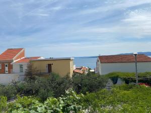a view of some houses and the ocean at Accommodation Ventus in Baška Voda +34 photos