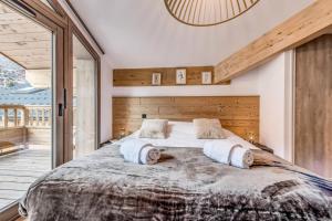 Cama ou camas em um quarto em Résidence Les Terrasses De La Vanoise - Pièces 501