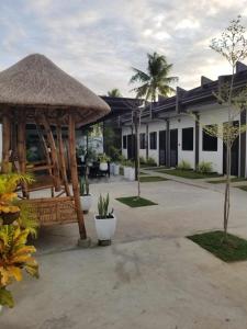 a resort with a gazebo and a building at JSS PENSION HOUSE 
