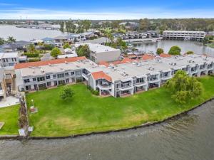 an aerial view of a house on an island in the water at Yarrawonga Lakeside Apartment 23 in Mulwala