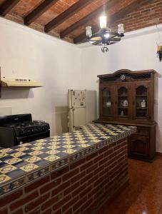 a kitchen with a large bed in a room at casa mangos in Temixco