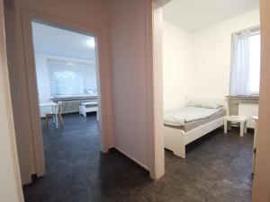 a bedroom with a bed and a mirror in a room at 2 Room Apartment 15min to Fair in Hannover