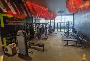 a gym with rows of treadmills and machines at Arte Cheras, Kuala Lumpur 3 Room x 8 pax KLCC Nice View Karaoke with BathTub in Kuala Lumpur
