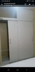 a large white garage door in a room at July in San Felipe de Puerto Plata