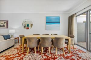 a dining room with a table and chairs at Family Comfort - Walk to Beaches, Train and Coffee in Fremantle +16 photos