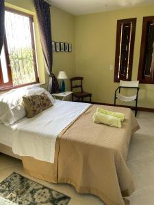 A bed or beds in a room at Quarto próximo a Guarajuba