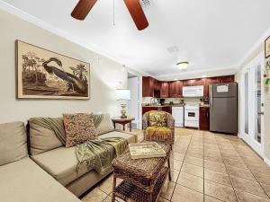 a living room with a couch and a table at Paradise Cove at Island Getaway in Bradenton Beach