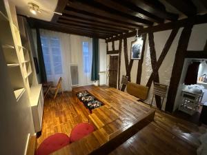 an overhead view of a living room with a wooden floor at Loft sur Notre-Dame/Saint-Michel in Paris