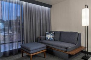 a living room with a couch and a chair at Courtyard by Marriott Nashville Smyrna in Smyrna