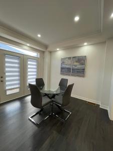 a meeting room with two chairs and a table in it at Your home away from home in Hamilton