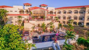 an aerial view of a resort with a swimming pool at Hotel Palacio Puerto Princesa in Puerto Princesa City