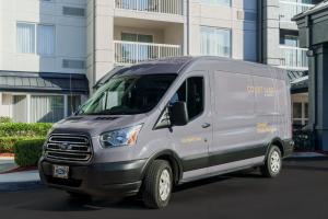 a silver van parked in front of a building at Courtyard by Marriott Orlando Downtown in Orlando