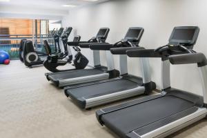 a row of treadmills in a gym at Courtyard by Marriott Orlando Downtown in Orlando