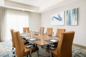 a conference room with a long table and chairs at Courtyard by Marriott Orlando Downtown in Orlando