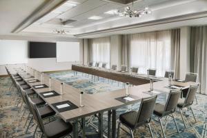 a conference room with a long table and chairs at Courtyard by Marriott Orlando Downtown in Orlando