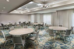 a conference room with tables and chairs in a row at Courtyard by Marriott Orlando Downtown in Orlando