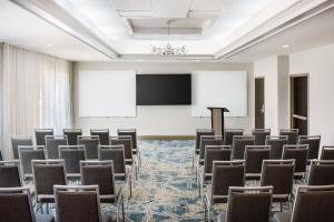 a conference room with chairs and a podium at Courtyard by Marriott Orlando Downtown in Orlando