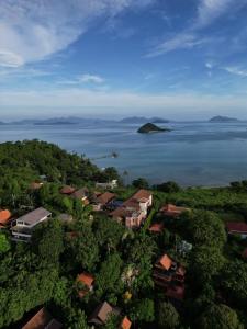 an aerial view of a village and the ocean at Koh Mak Penthouse in Ko Mak