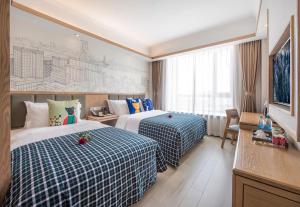 Cama o camas de una habitación en Mehood Theater Hotel, Shanghai Jinqiao 18 fotos más