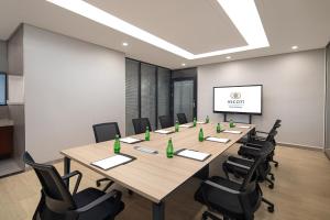 a conference room with a long table and chairs at Ascott Guangzhou in Guangzhou +42 photos