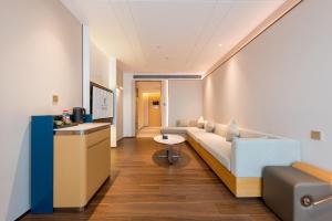 Area soggiorno di Mehood Elegant Hotel Guangzhou Baiyun Airport Huadu Cultural Tourism City