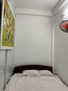 Giường trong phòng chung tại Vitawell Homestay