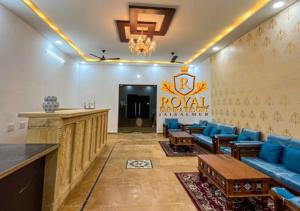 a lobby of a hotel with a blue couch at Royal Empire Resort Jaisalmer in Jaisalmer