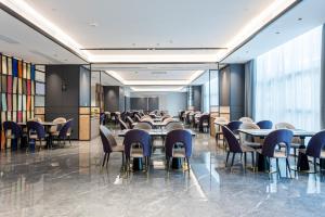 Area soggiorno di Mehood Elegant Hotel Guangzhou Baiyun Airport Huadu Cultural Tourism City