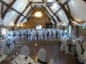 a banquet hall with white tables and chairs at Le Domaine des Cigognes in Ennevelin