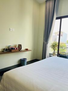 Postel nebo postele na pokoji v ubytování De V’Charm Hotel