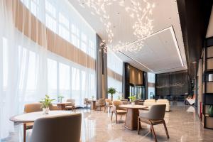 Area soggiorno di Mehood Elegant Hotel Guangzhou Baiyun Airport Huadu Cultural Tourism City