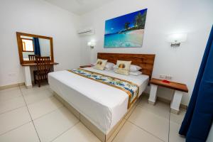 Ένα ή περισσότερα κρεβάτια σε δωμάτιο στο Lazio Beach Residence