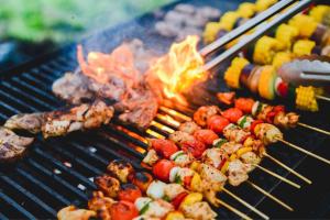 a bunch of different types of food on a grill at Hotel Stripes Kuala Lumpur, Autograph Collection in Kuala Lumpur