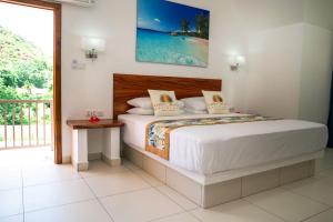 Ένα ή περισσότερα κρεβάτια σε δωμάτιο στο Lazio Beach Residence