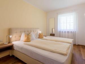 Ein Bett oder Betten in einem Zimmer der Unterkunft South - Ferienhof Zwerger