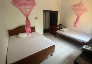 Postel nebo postele na pokoji v ubytování Feel Like Home Anuradhapura + 26 fotografií