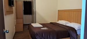 Magizham Homestay客房内的一张或多张床位