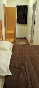 Magizham Homestay客房内的一张或多张床位